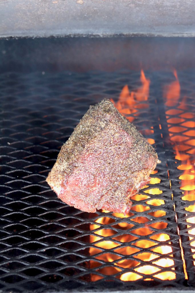 rump roast with garlic and pepper crust on grill
