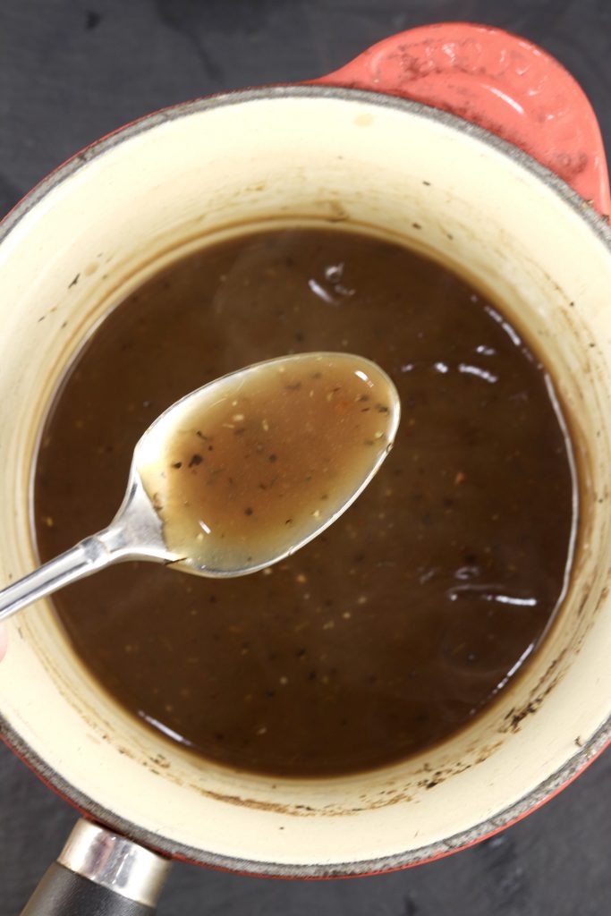 Coca-Cola Sauce in a pan, spoonful over the pan