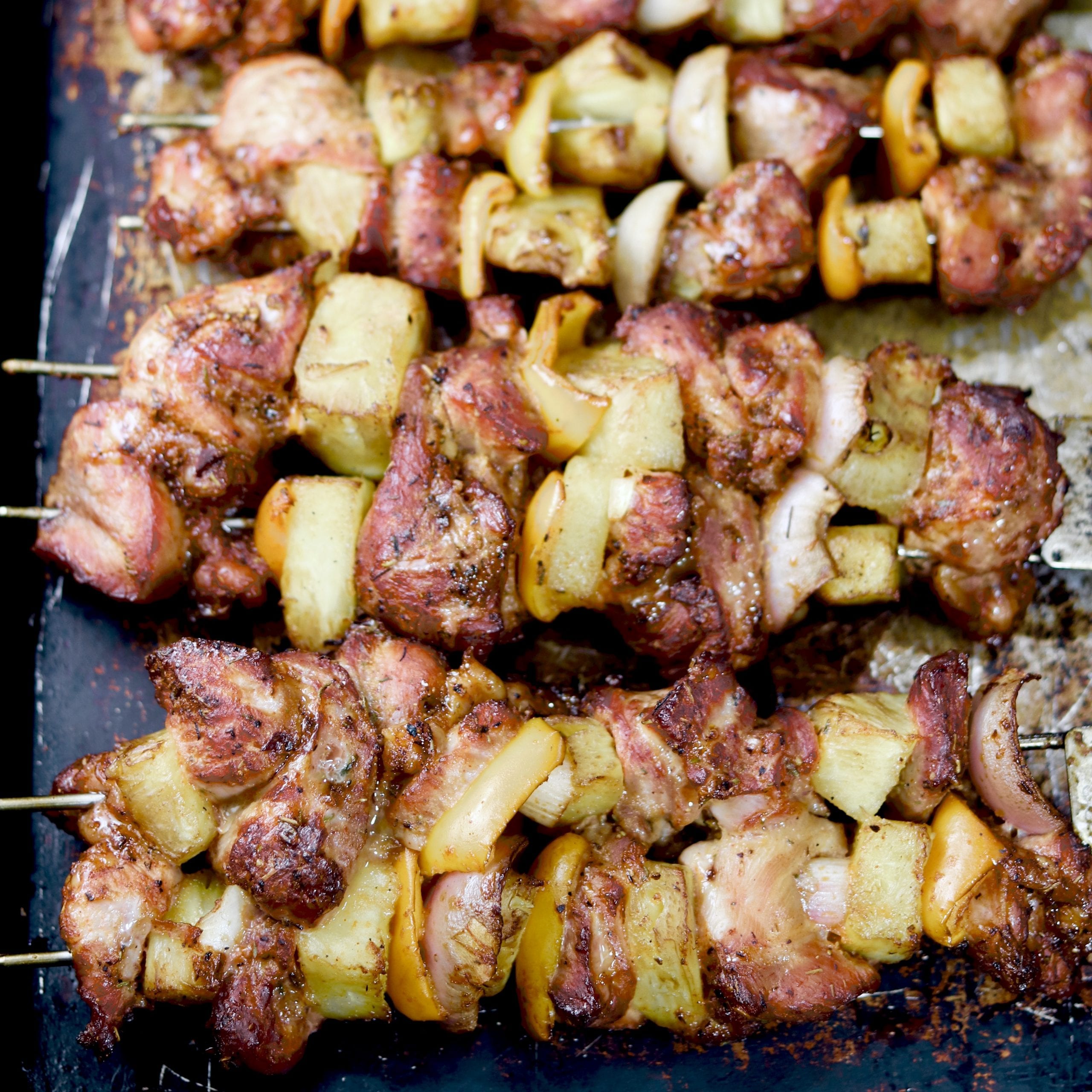 Grilled Pork, Pineapple, Peppers and Onion Kabobs on a sheet pan