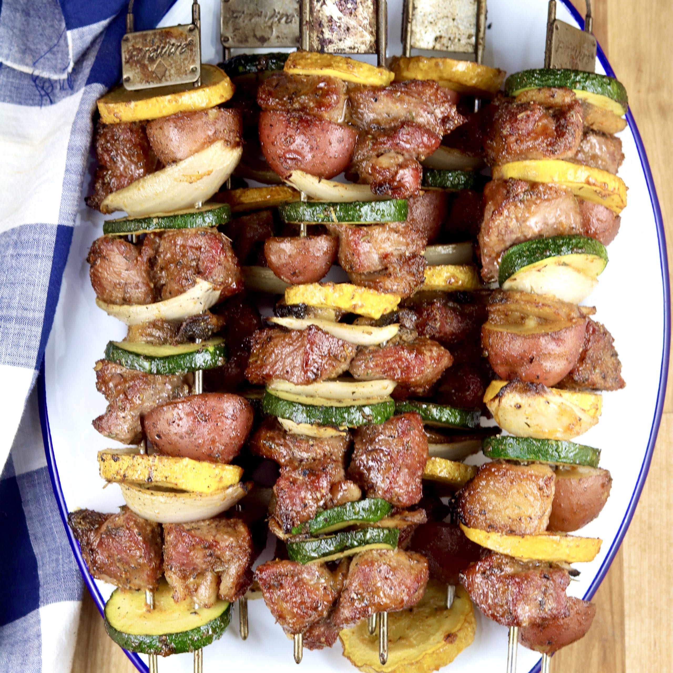 Grilled Steak and Vegetable Kabobs in a white tray