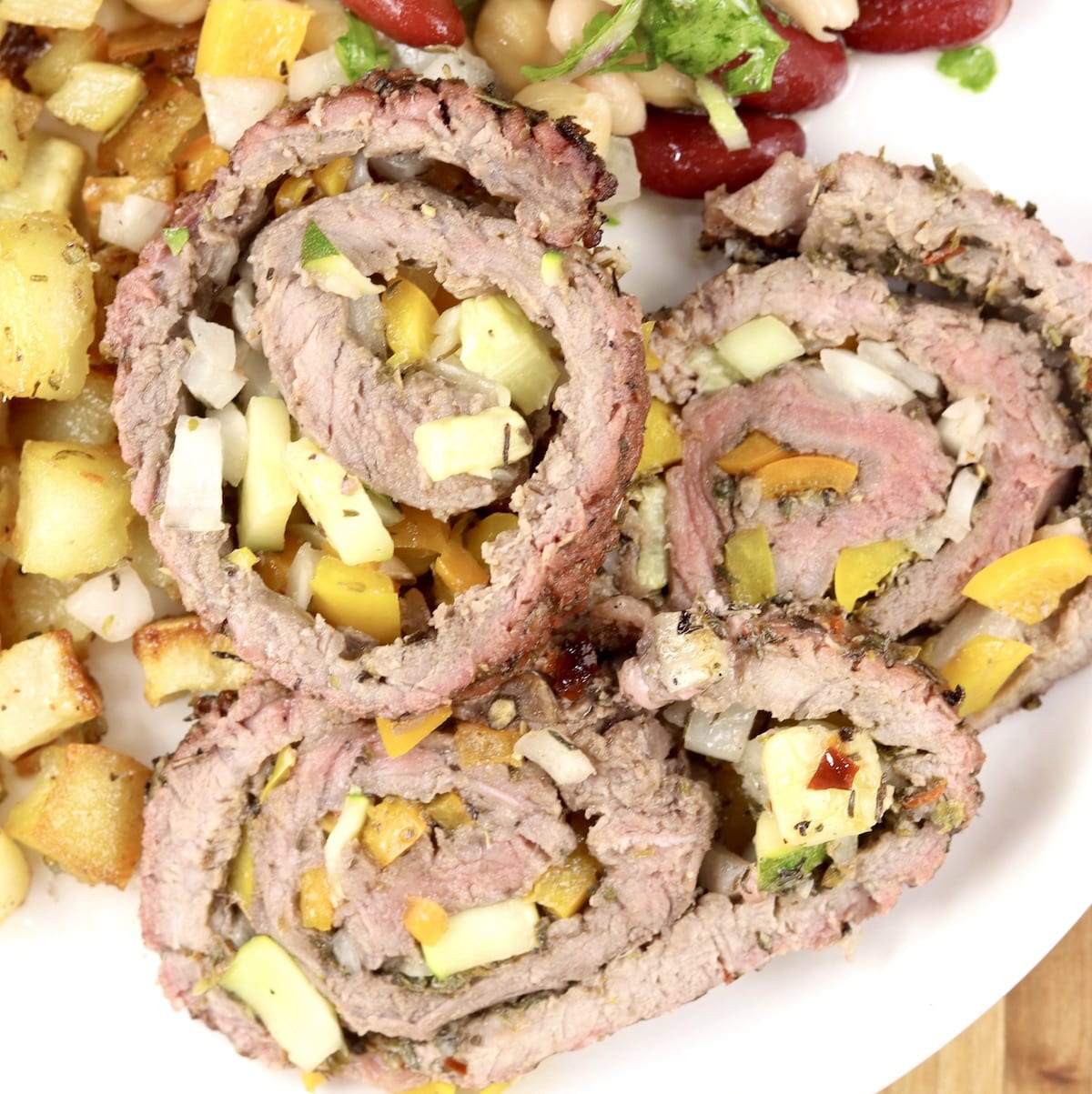 Grilled Steak Pinwheels with zucchini, onions and peppers