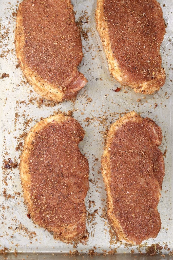 Brown Sugar Dry Rubbed Pork Chops on a sheet pan