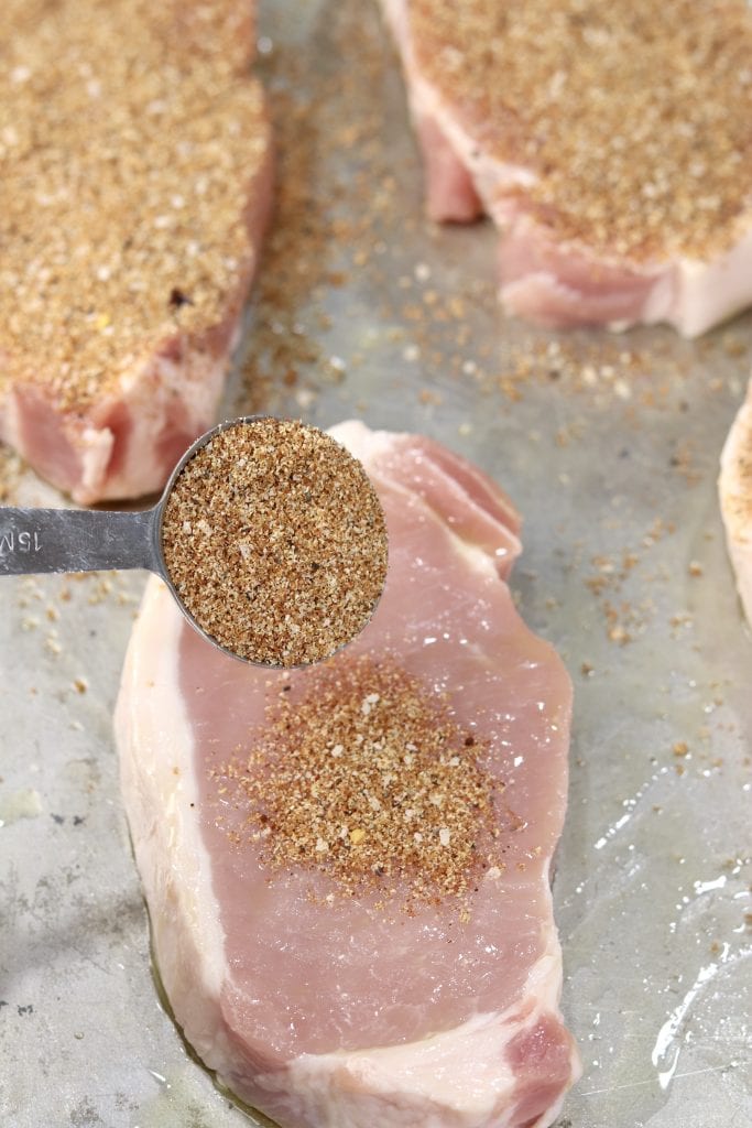 Seasoning pork chops with brown sugar dry rub