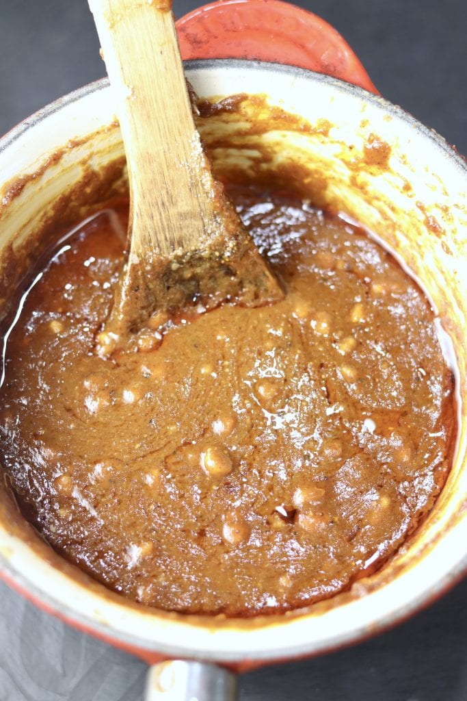 Peanut Sauce in a saucepan with wood spoon