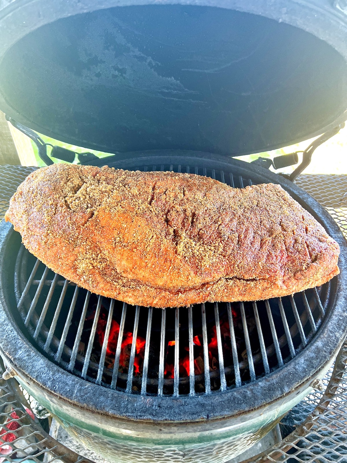 Whole beef brisket on a grill.