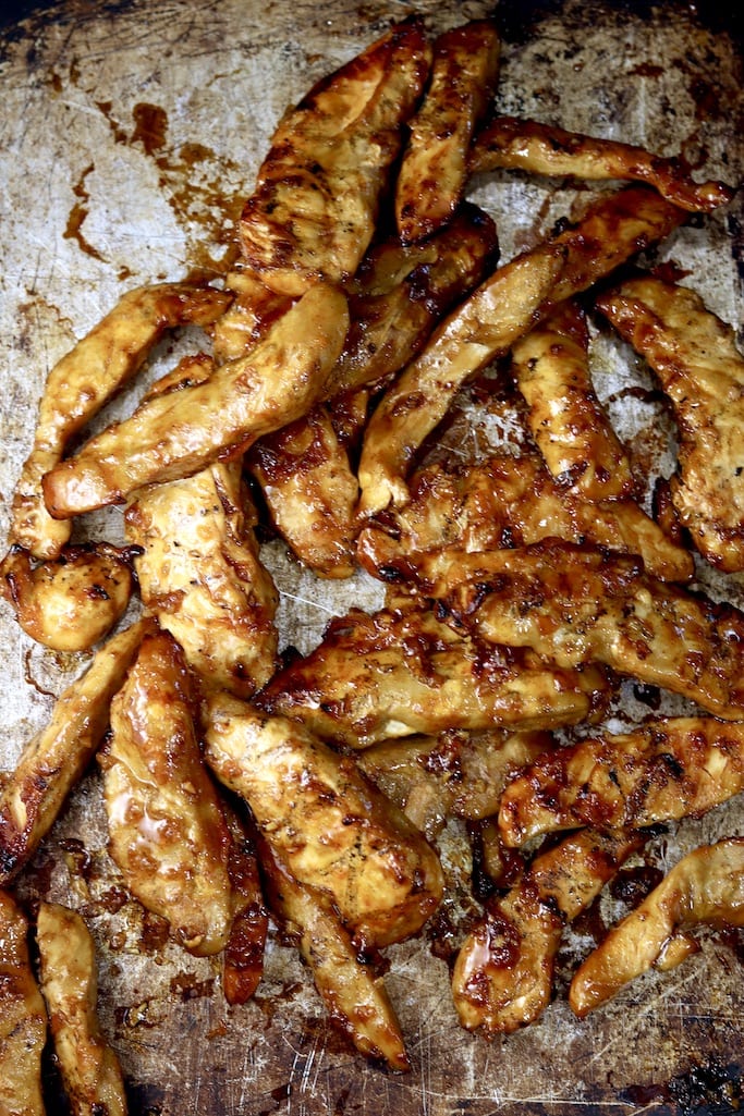 Grilled BBQ Chicken tenders on a sheet pans 