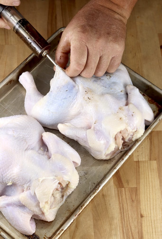 Injecting glaze under whole chicken skin