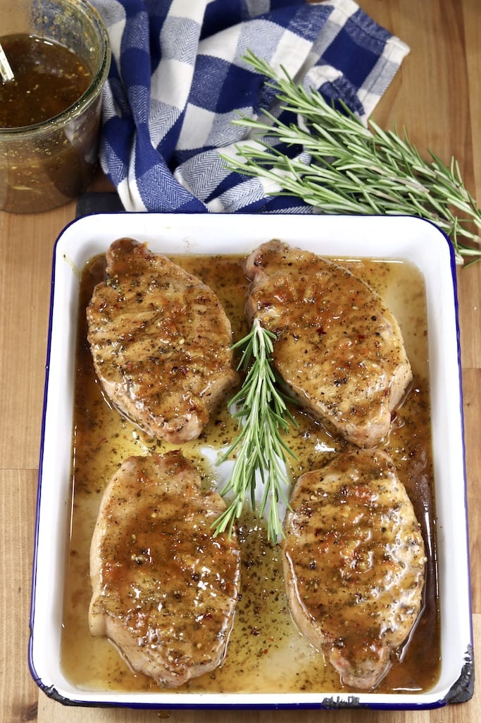 Pan of Glazed Pork Chops with orange bbq sauce and rosemary