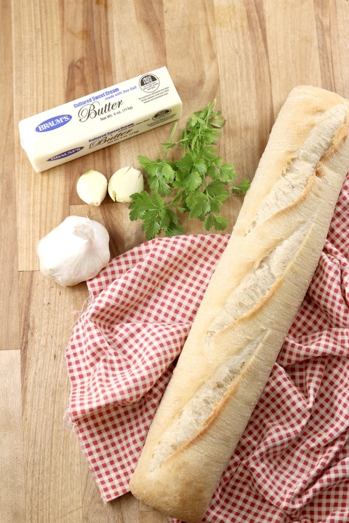 Ingredients to make grilled garlic bread with a baguette