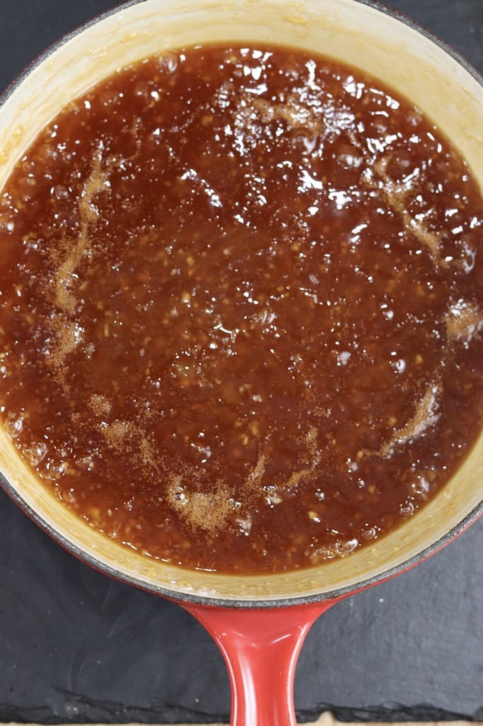 Boiling pineapple bbq sauce in a pan