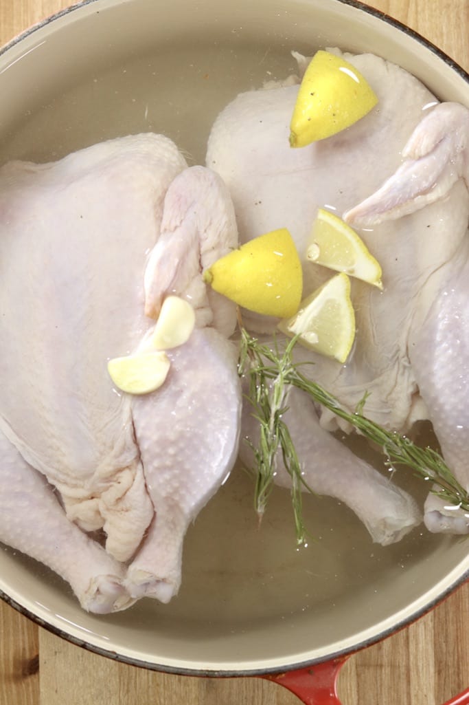 2 chickens brined in salt water with rosemary, fresh lemons and garlic 