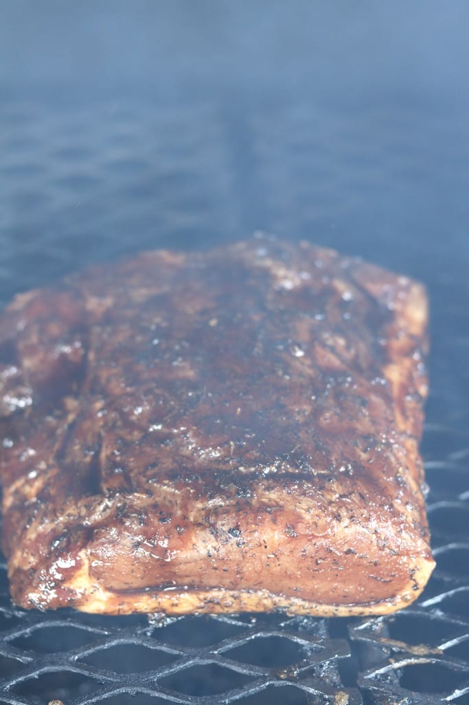 Marinated pork loin on a wood fired grill
