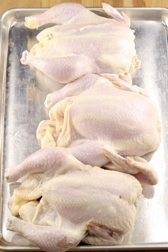 Sheet pan with 3 raw chickens