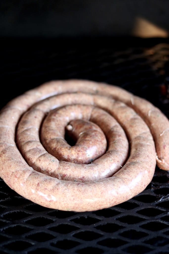 Spiral of sausage links on grill