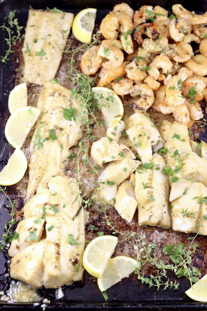 Fish and Shrimp on a baking pan with lemon garlic sauce