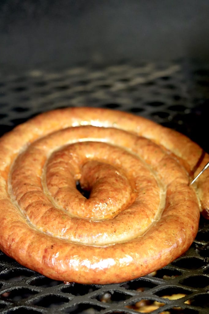 Smoked sausage spiral on grill