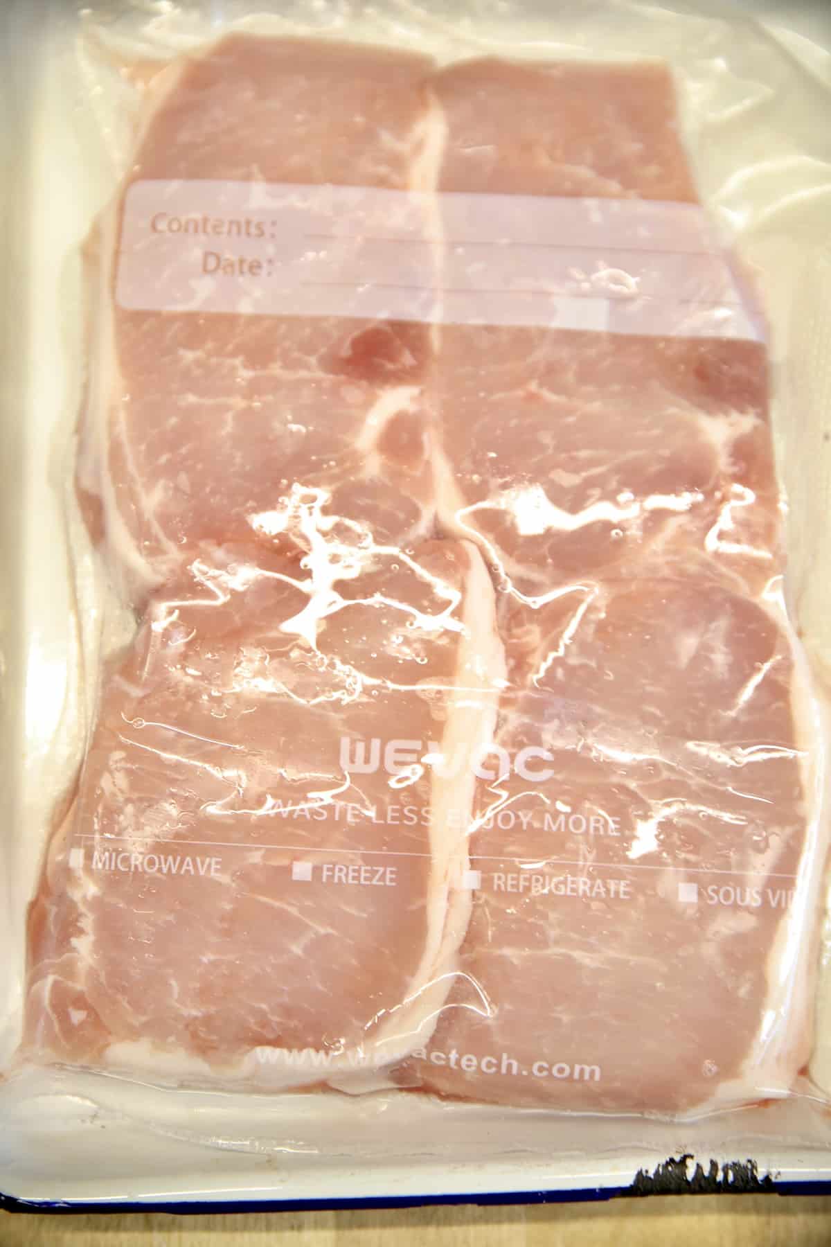 4 boneless pork chops in a package.