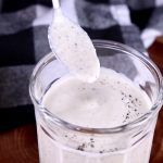 Spoonful of horseradish sauce dipping from jar