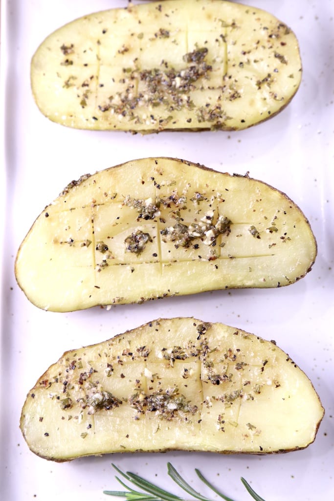 Garlic Butter Baked Potato Halves on a white platter