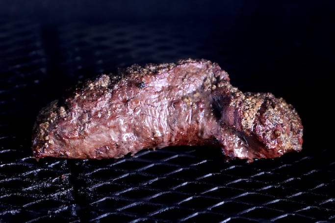 Beef Tenderloin on a grill with hickory smoke