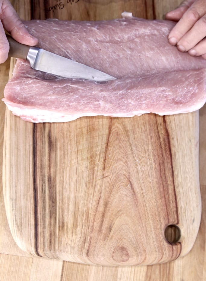 Slicing a pork tenderloin for stuffing and grilling