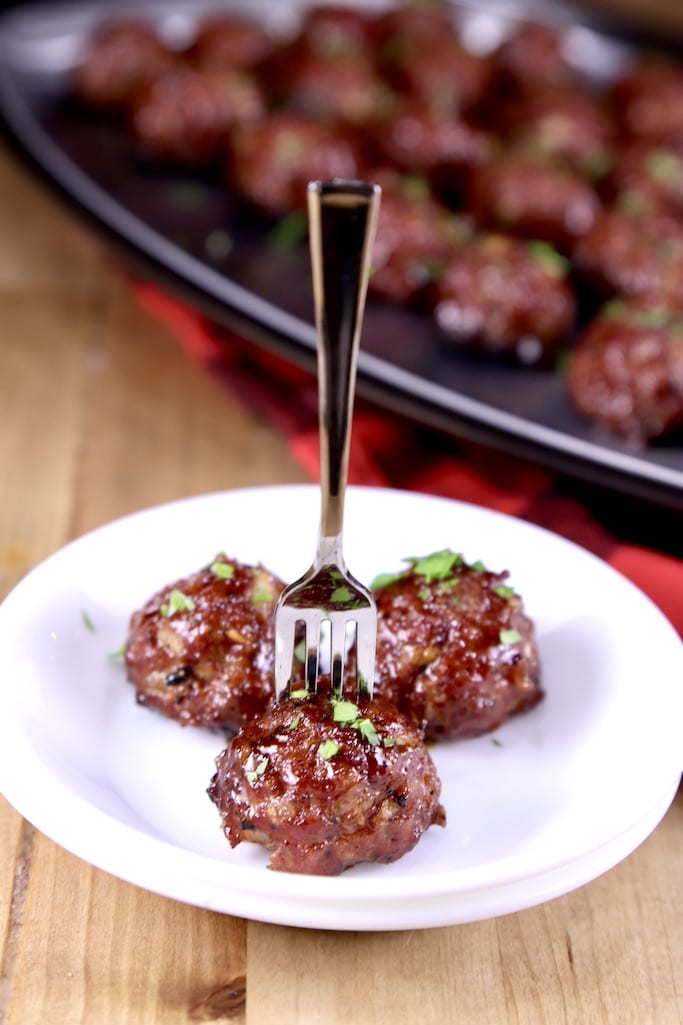 Peach BBQ Meatballs on appetizer plate with cocktail fork