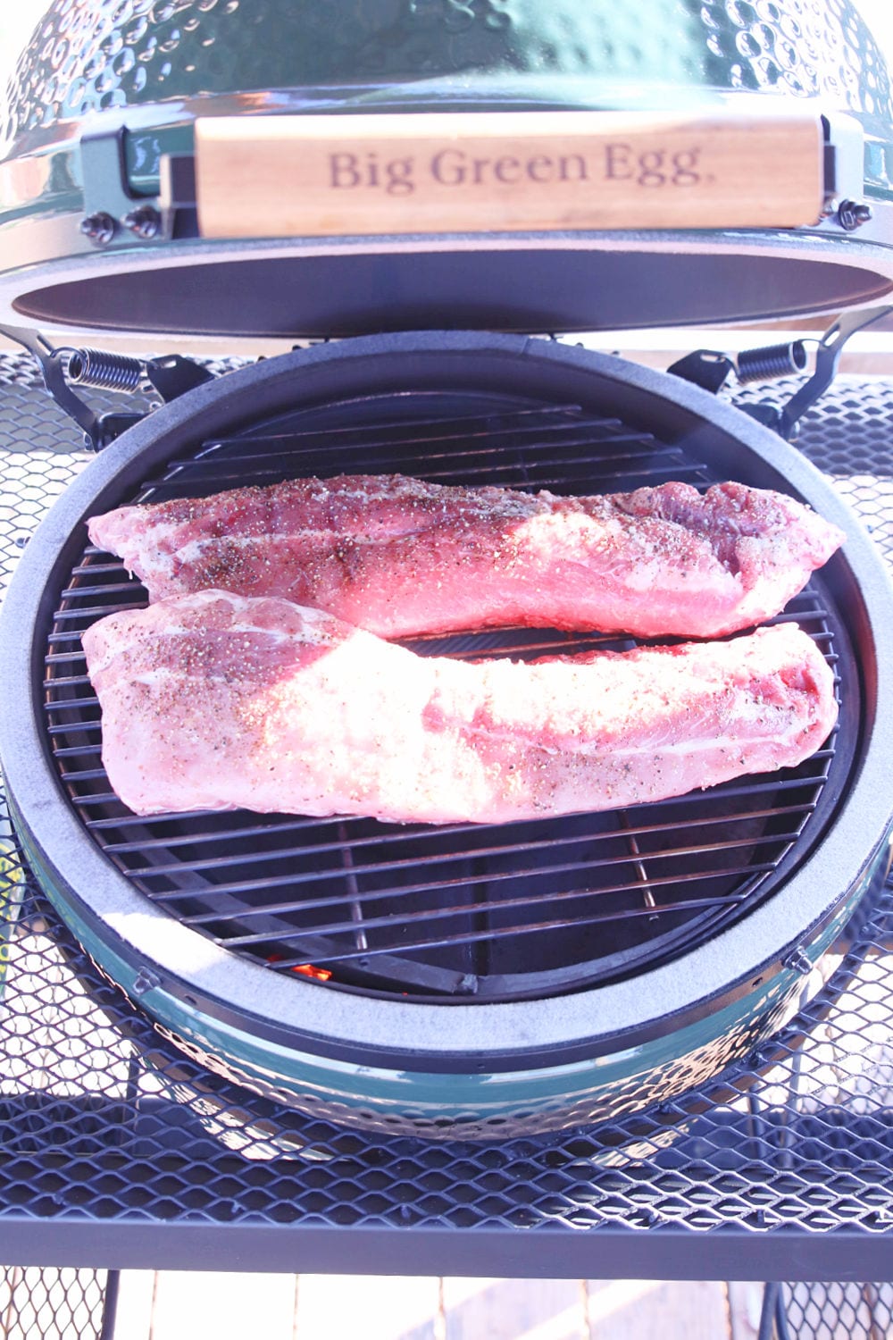 Big Green Egg Grill with 2 racks of baby back ribs