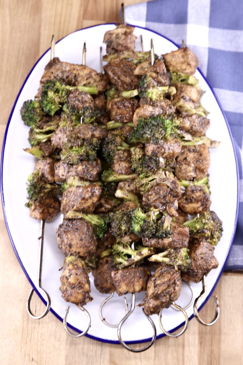 Platter of chicken and broccoli kabobs on an oval platter