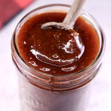 jar of bbq sauce with spoon