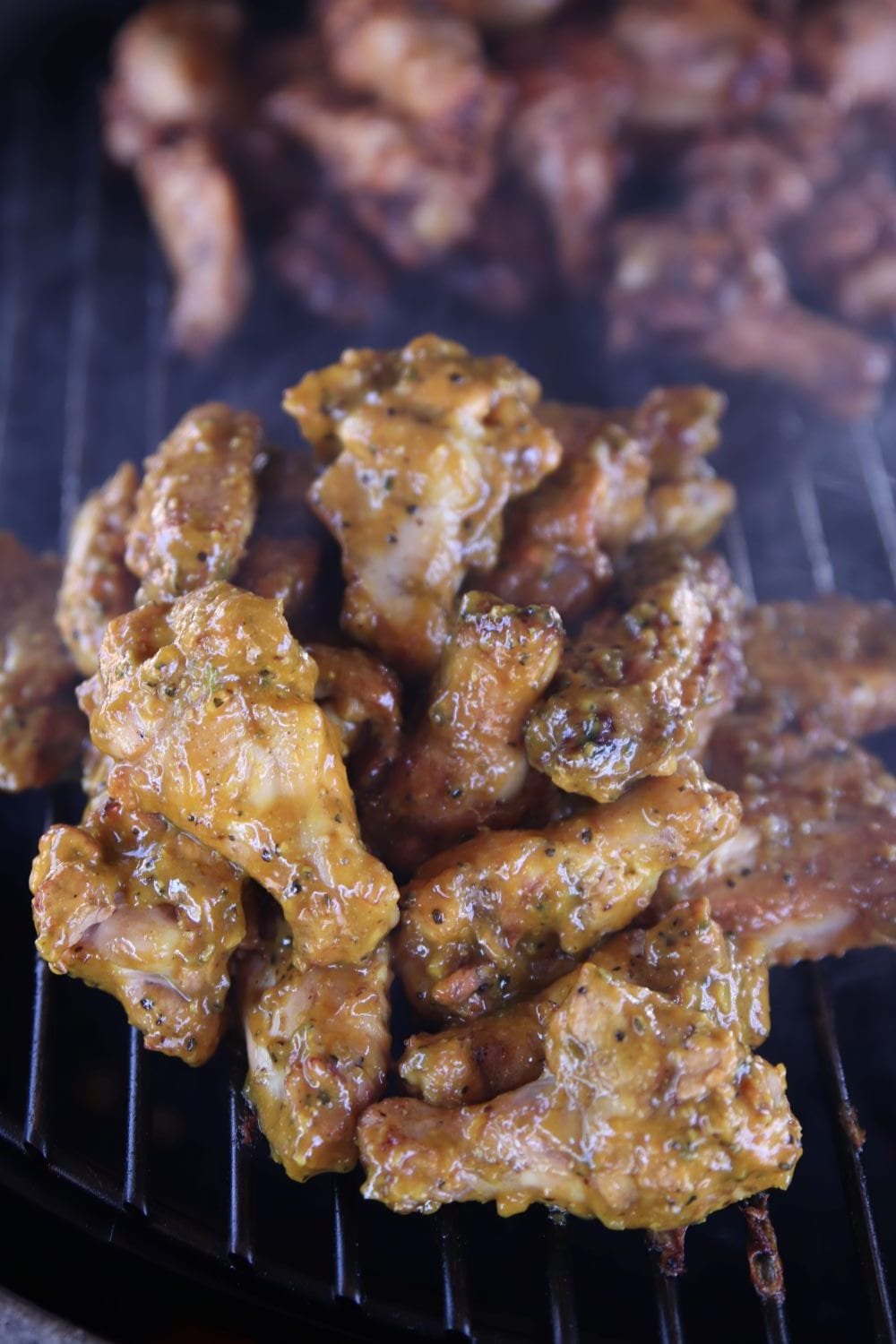 Mustard wings on a grill