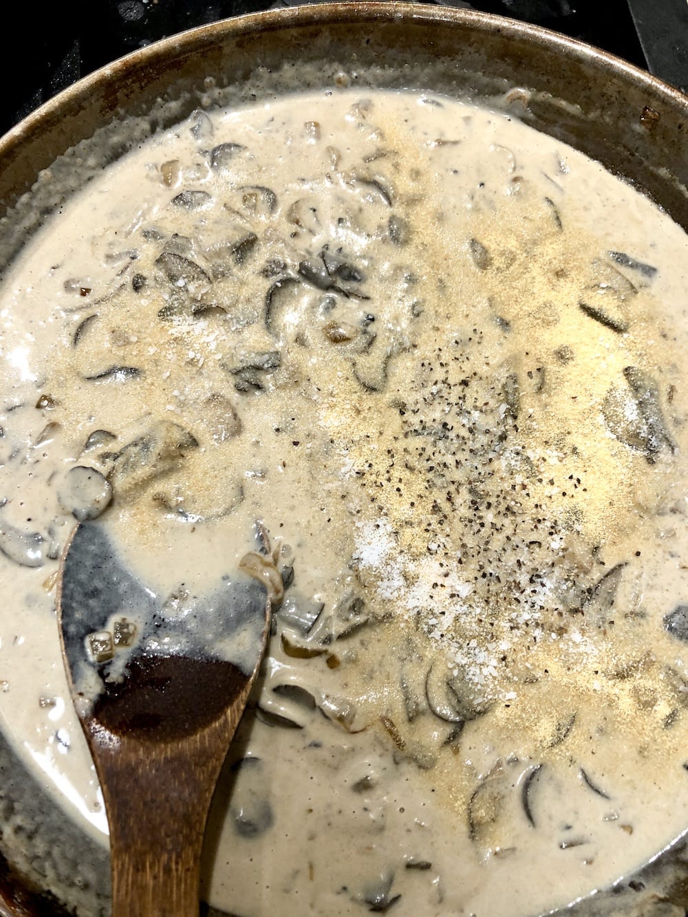 skillet of mushroom sauce with spices