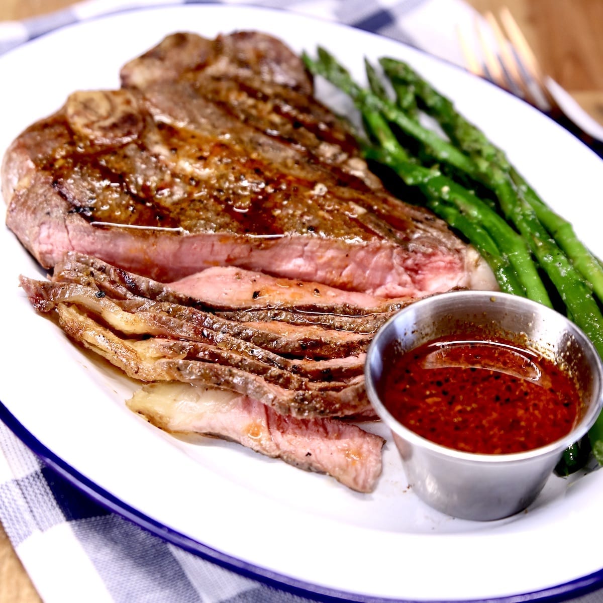 Whiskey Steak Sauce with a T Bone Steak and asparagus