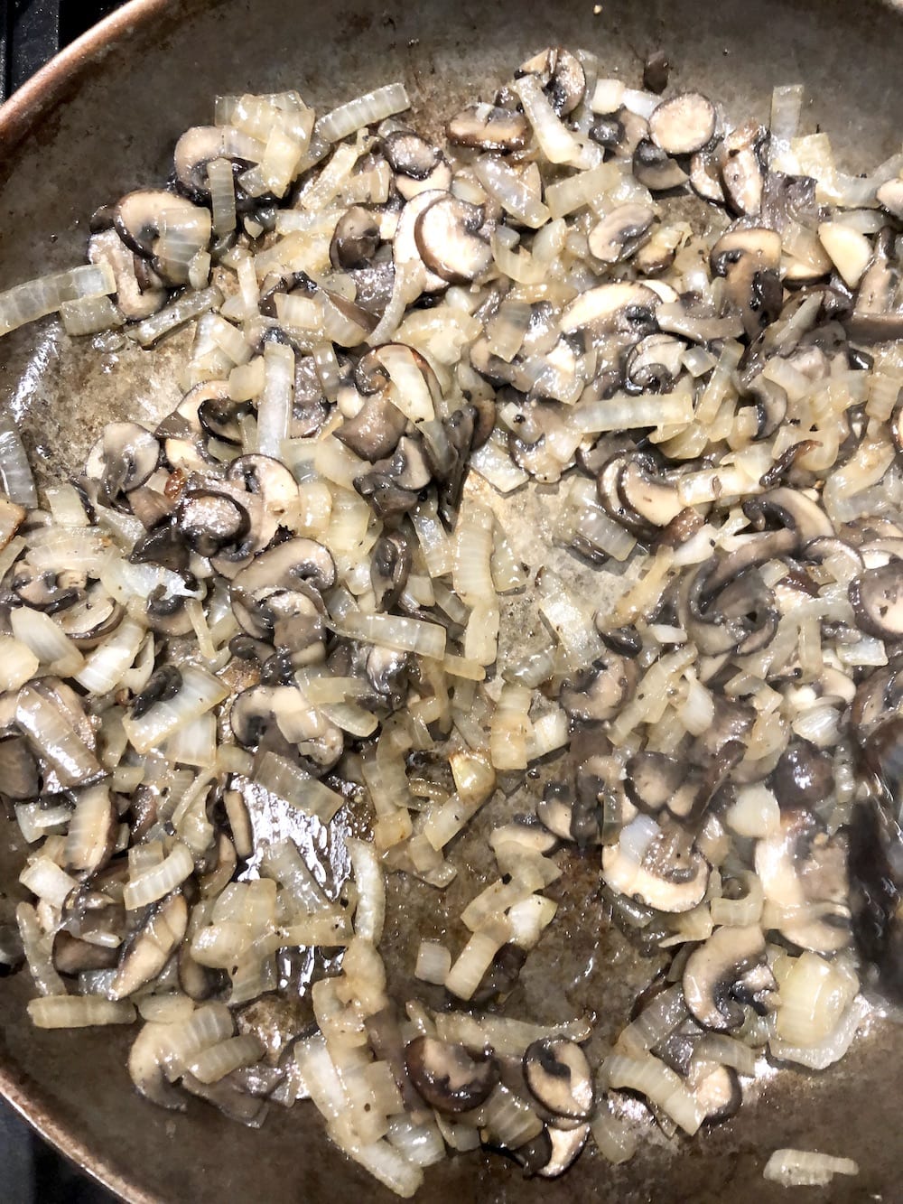skillet of cooked mushrooms and onions