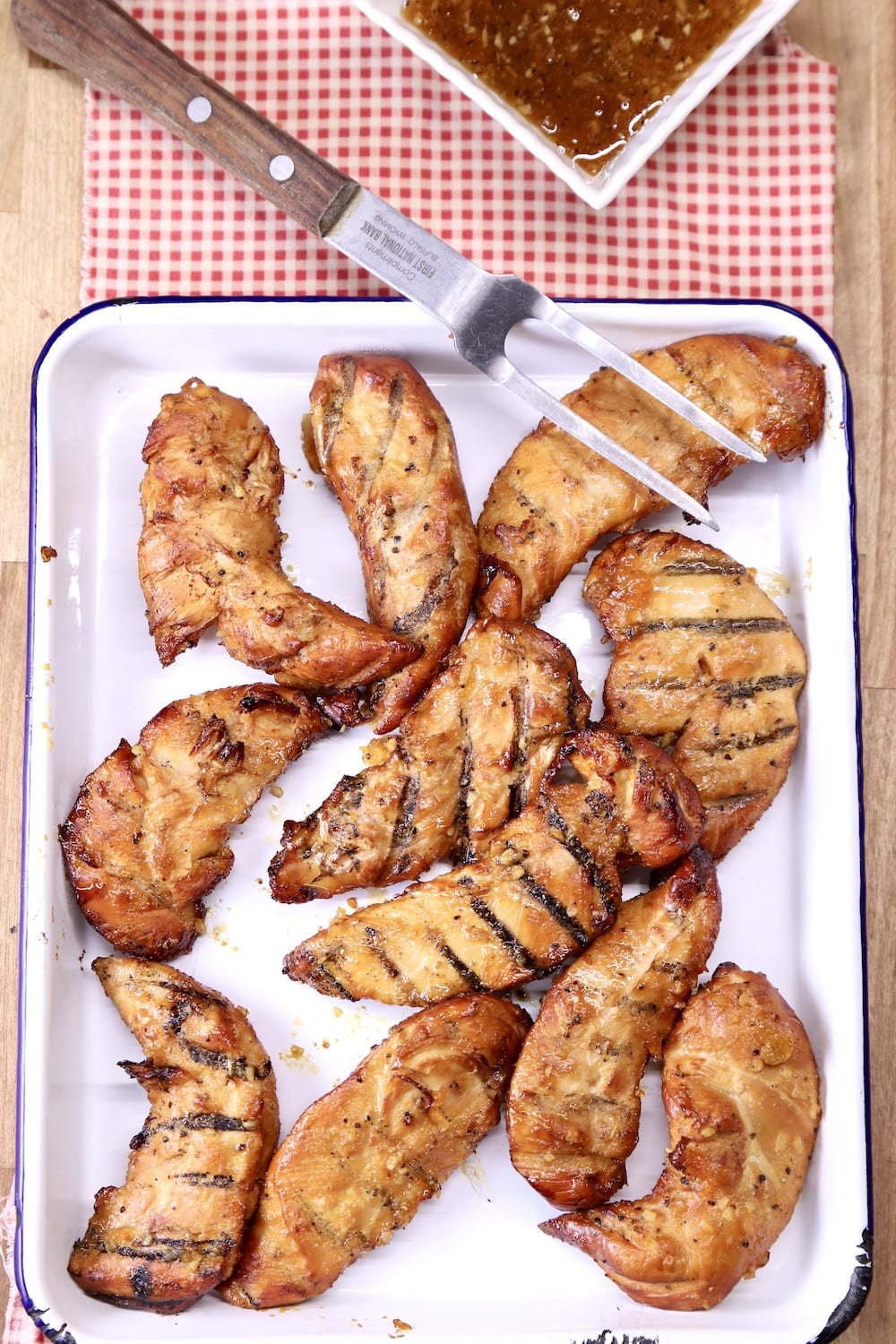 Grilled Chicken Tenders with a meat fork
