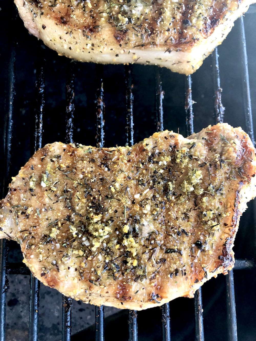 close up of grilled pork chop on grill