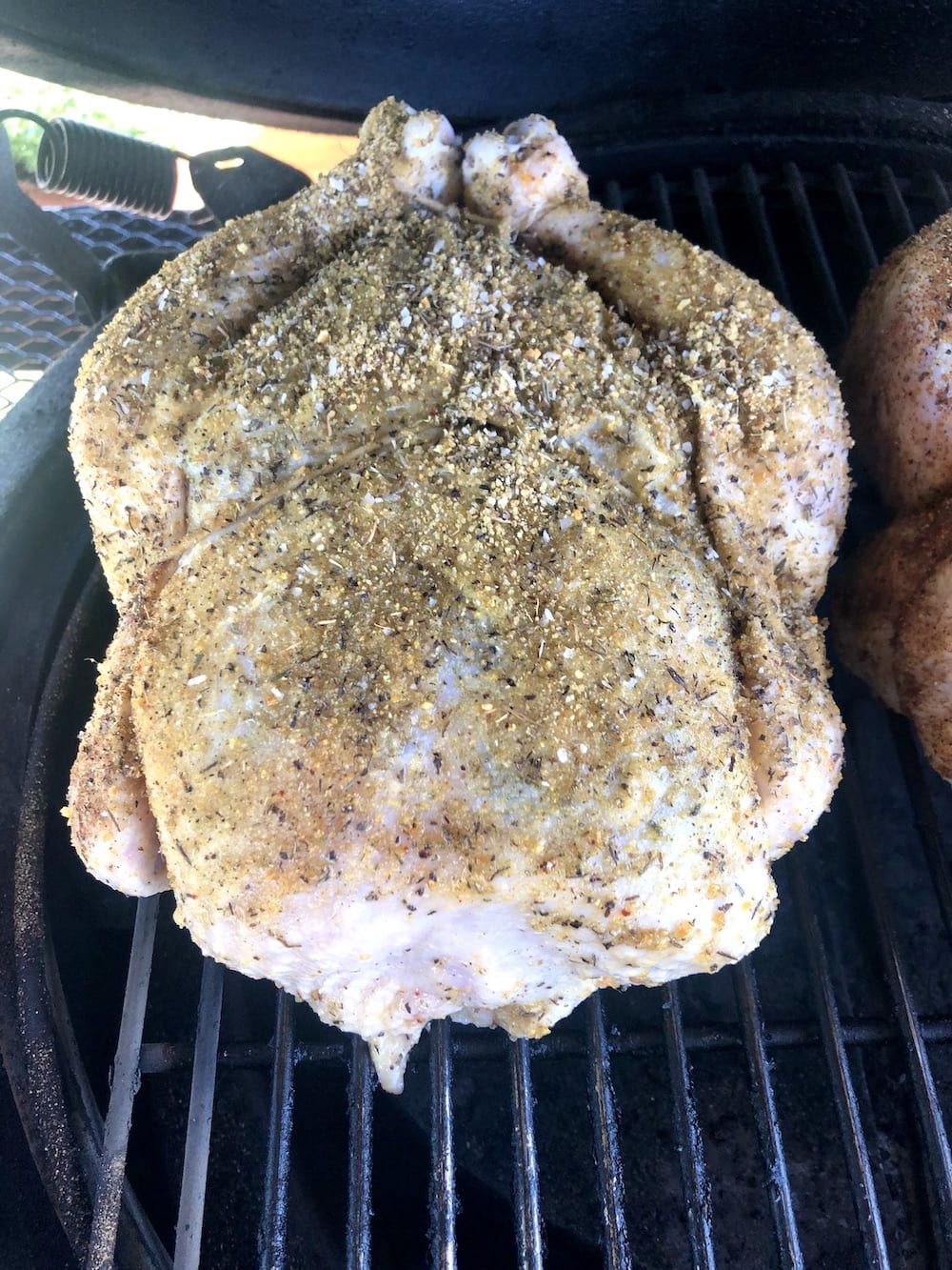 whole chicken on a bbq grill