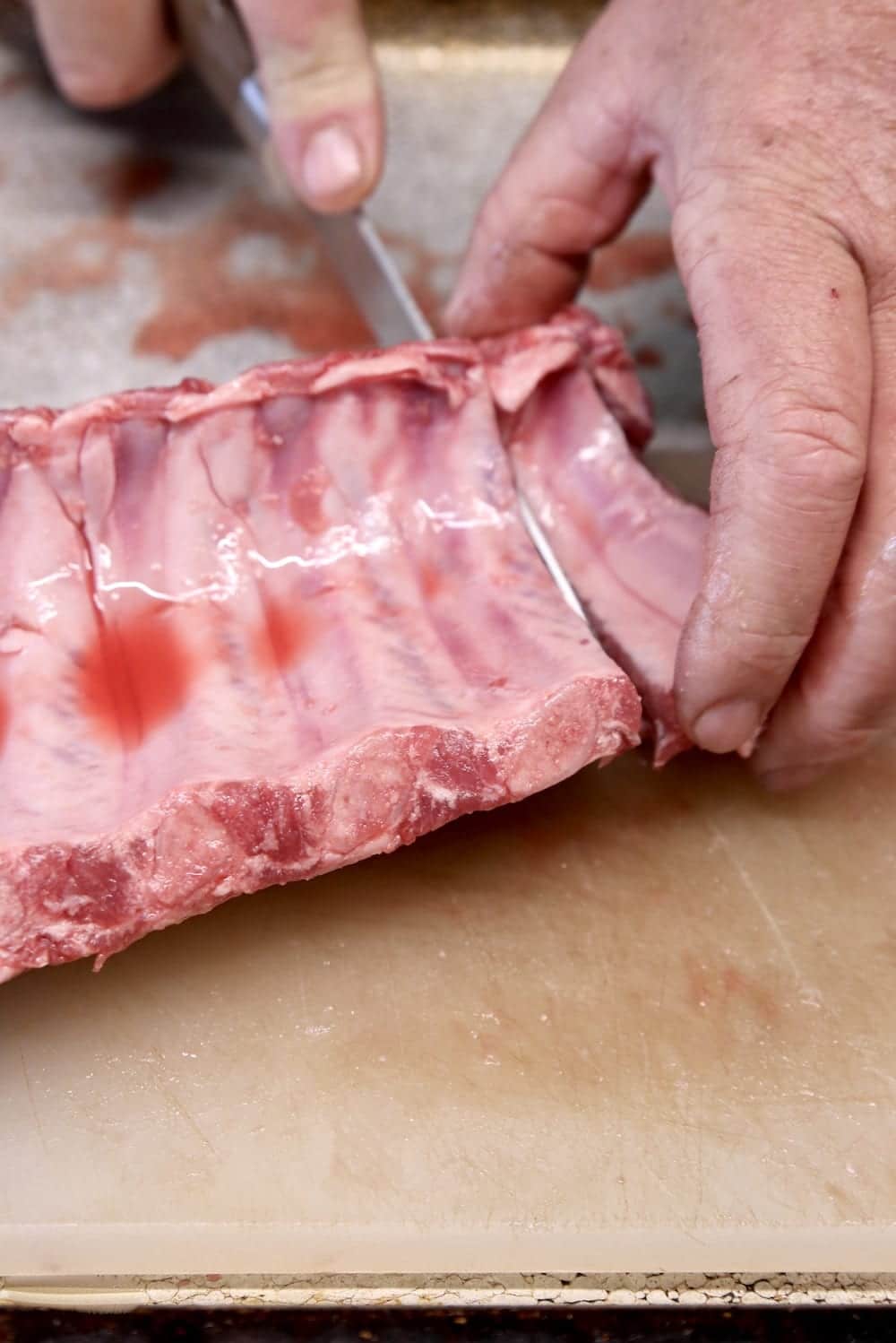 slicing ribs before cooking