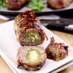 Armadillo Eggs with 2 slices off of the end, stuffed jalapeno showing in center