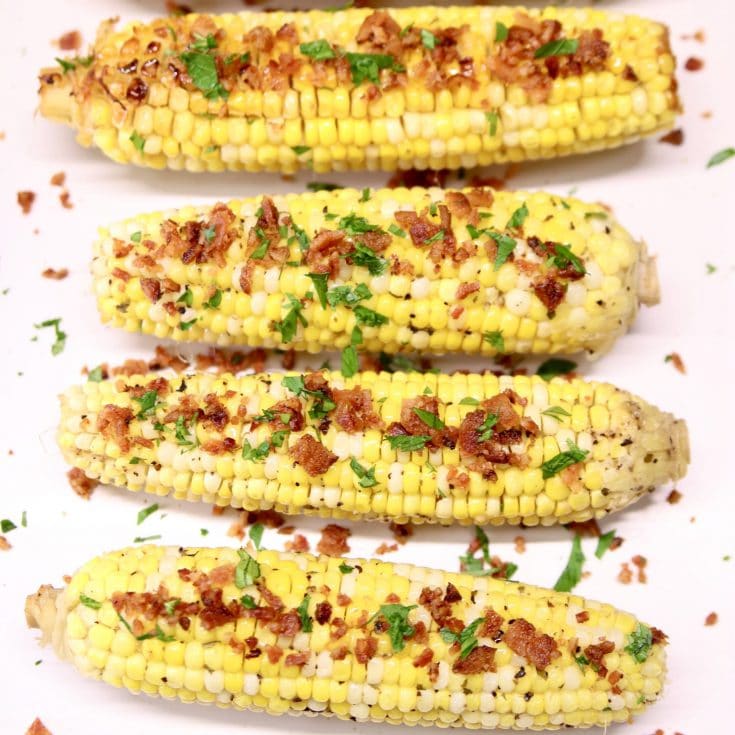 Corn on the cob with bacon crumbles