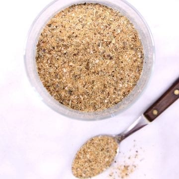 garlic and herb rub in a jar, spoonful on the counter