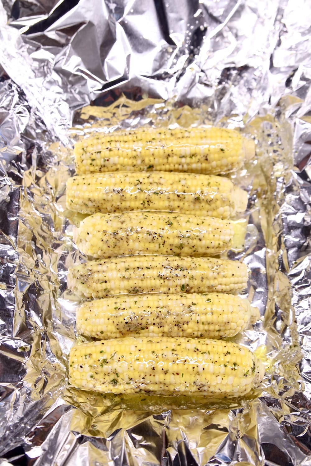 corn on the cob with ranch butter in foil for grilling