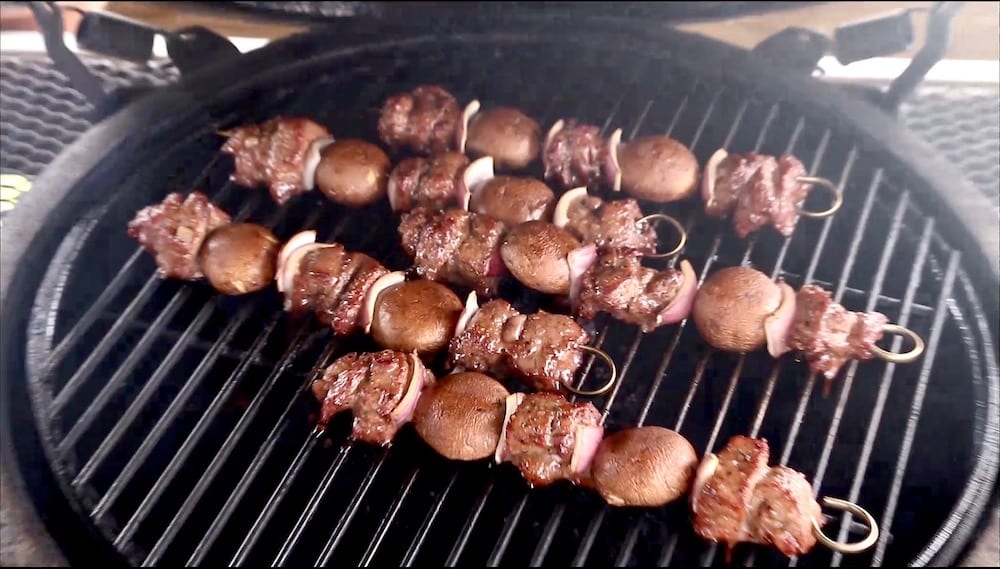 steak and mushroom kabobs on a grill