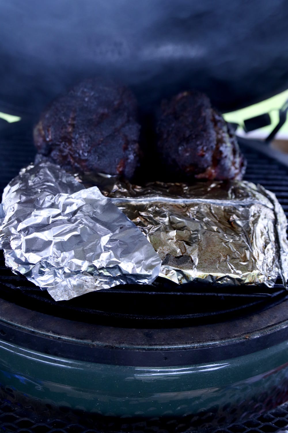 foil packet of corn on a grill