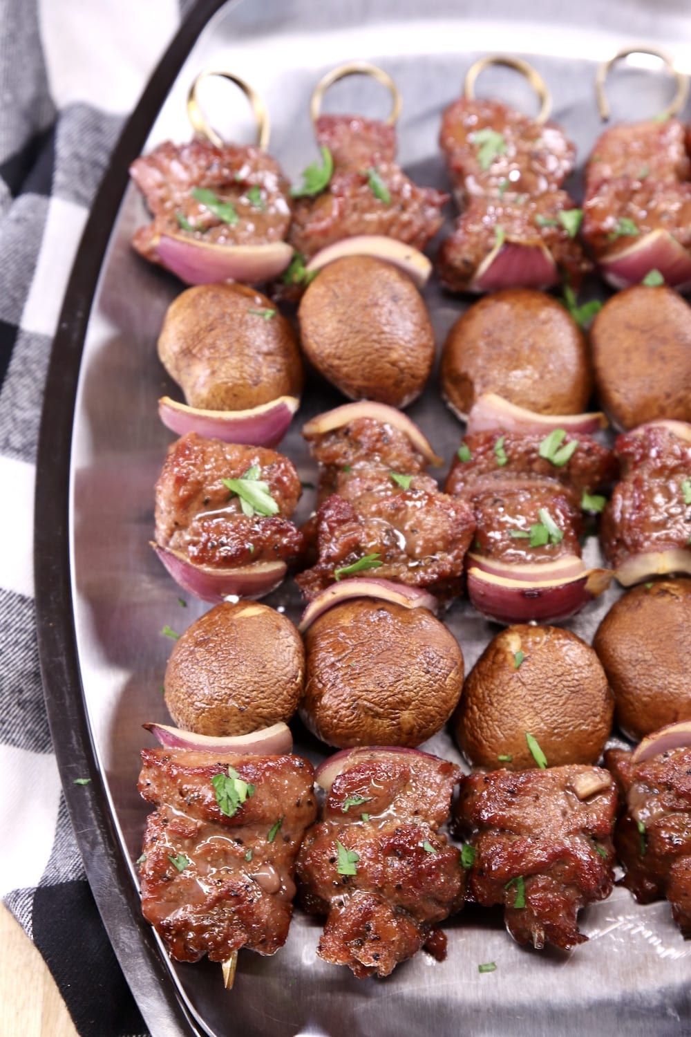 Steak and Mushroom Kabobs on a platter