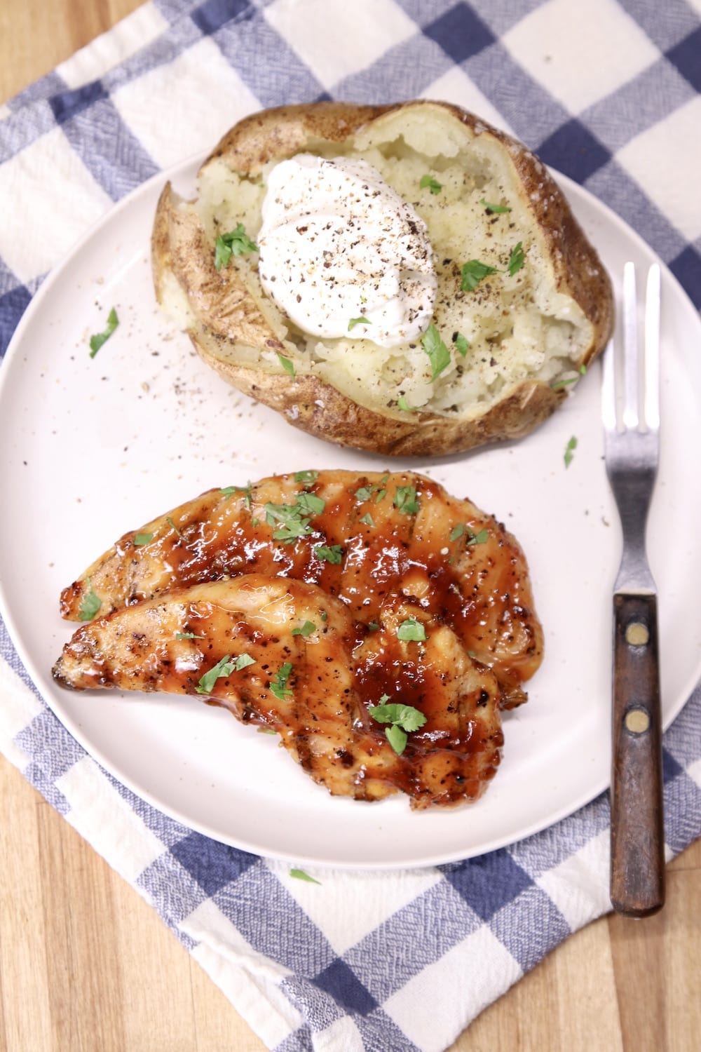 BBQ Chicken Tenders plated with baked potato