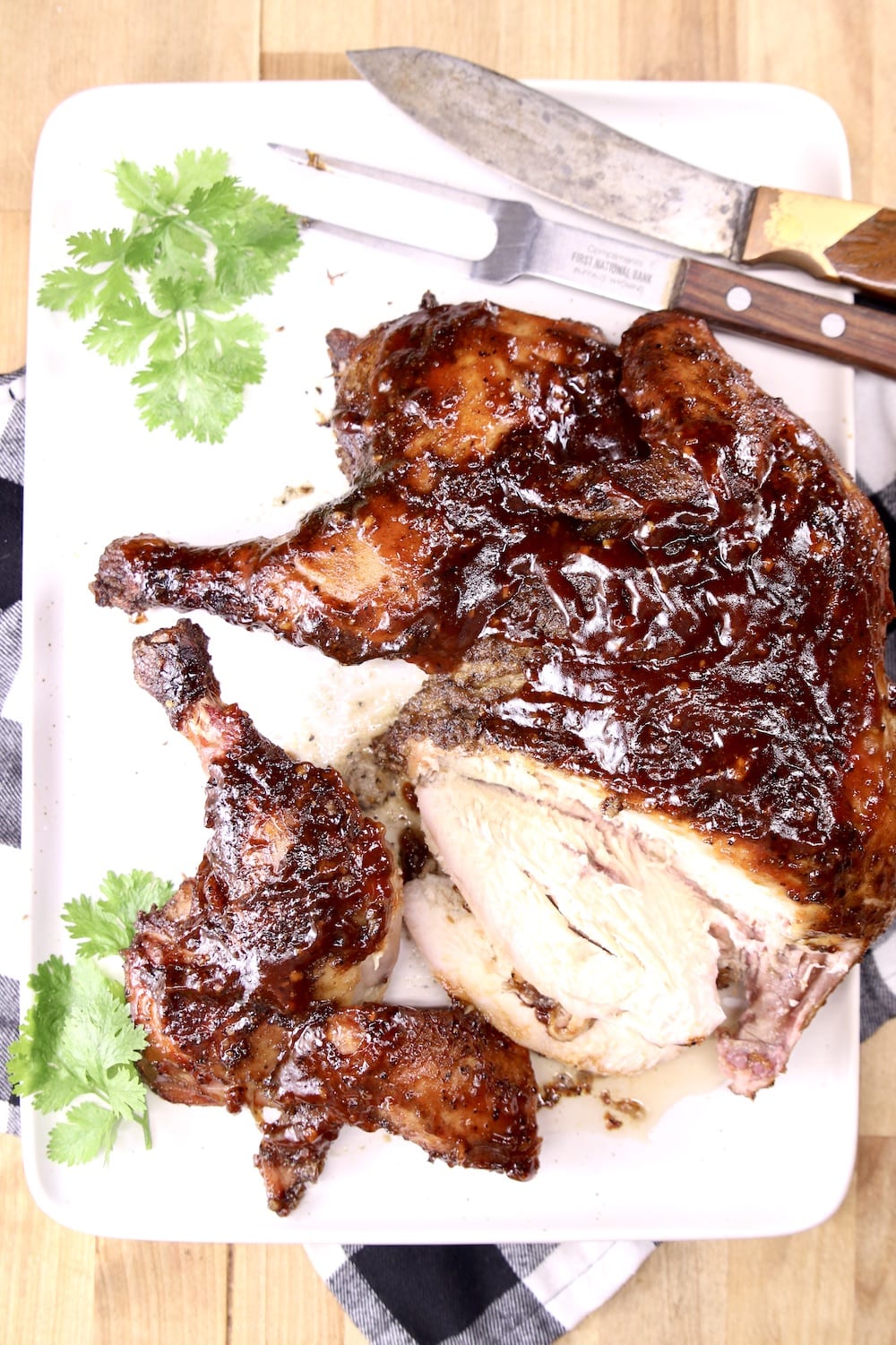 sliced spatchcock bbq chicken on a platter