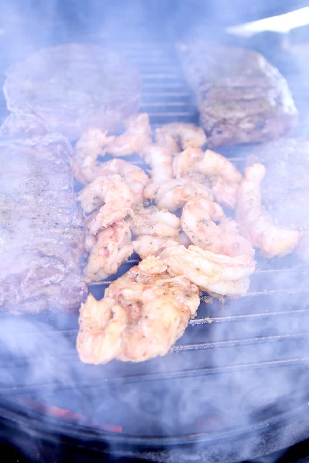grilling steaks and shrimp - smoky grill