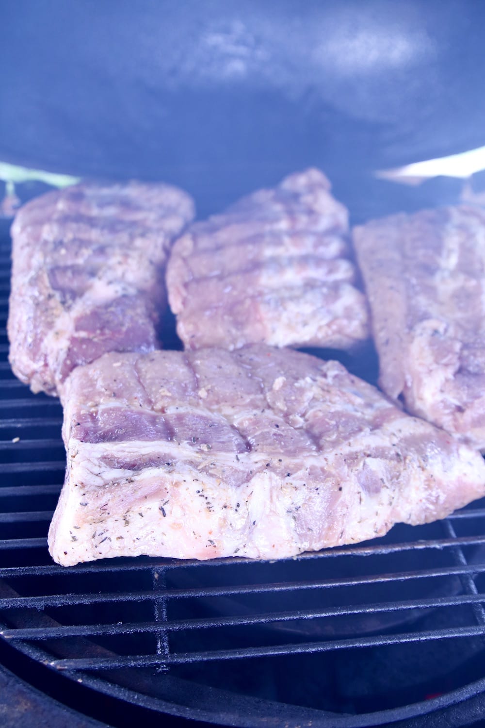 4 half racks of ribs on a grill