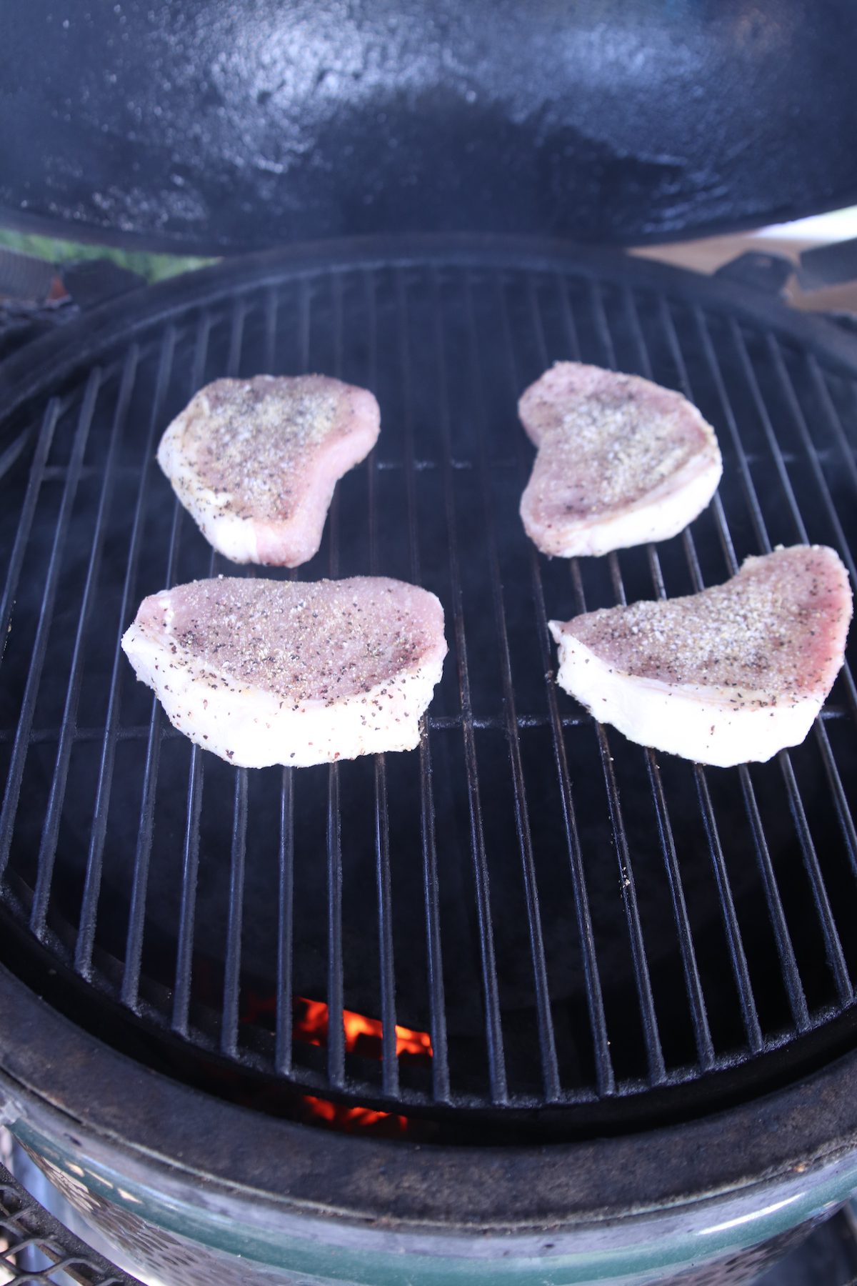 4 pork chops on a grill