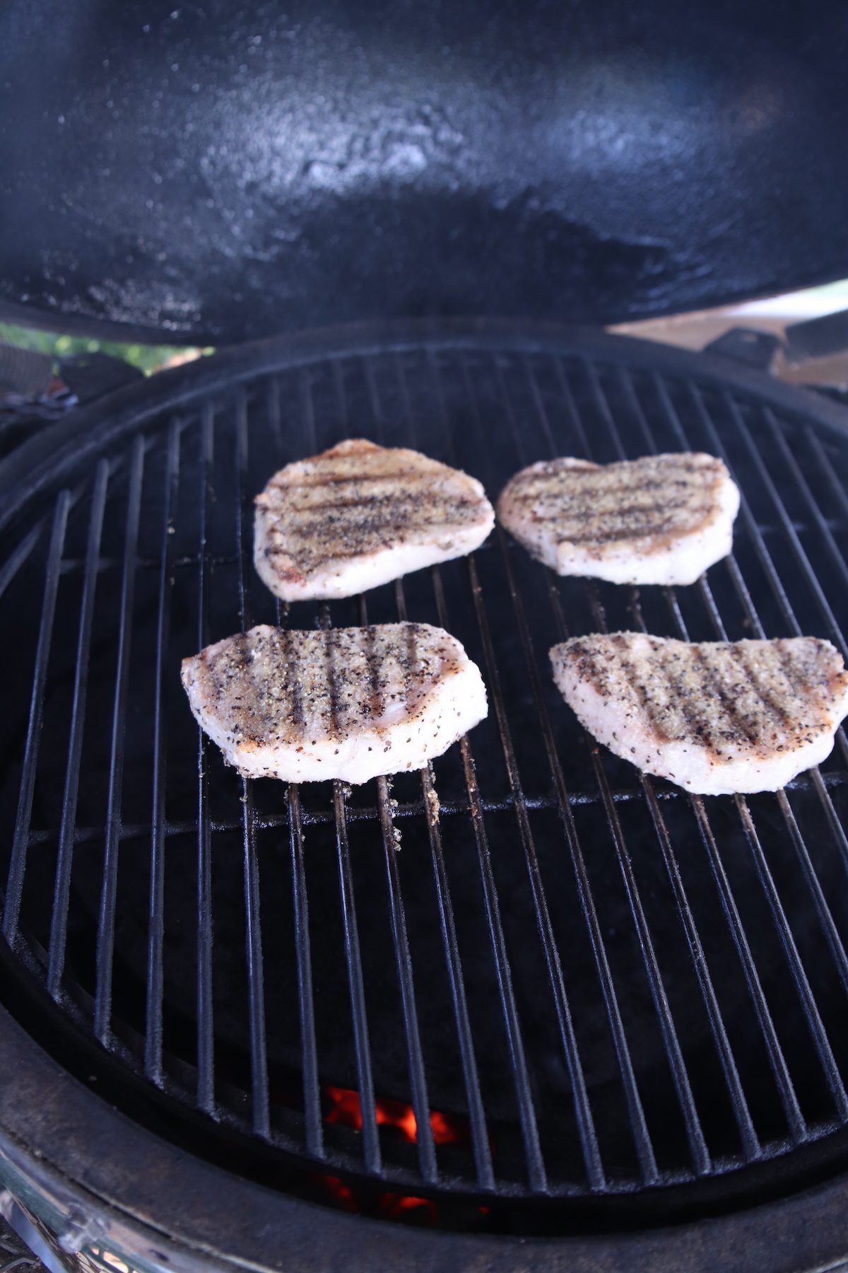 cooking pork chops on a grill